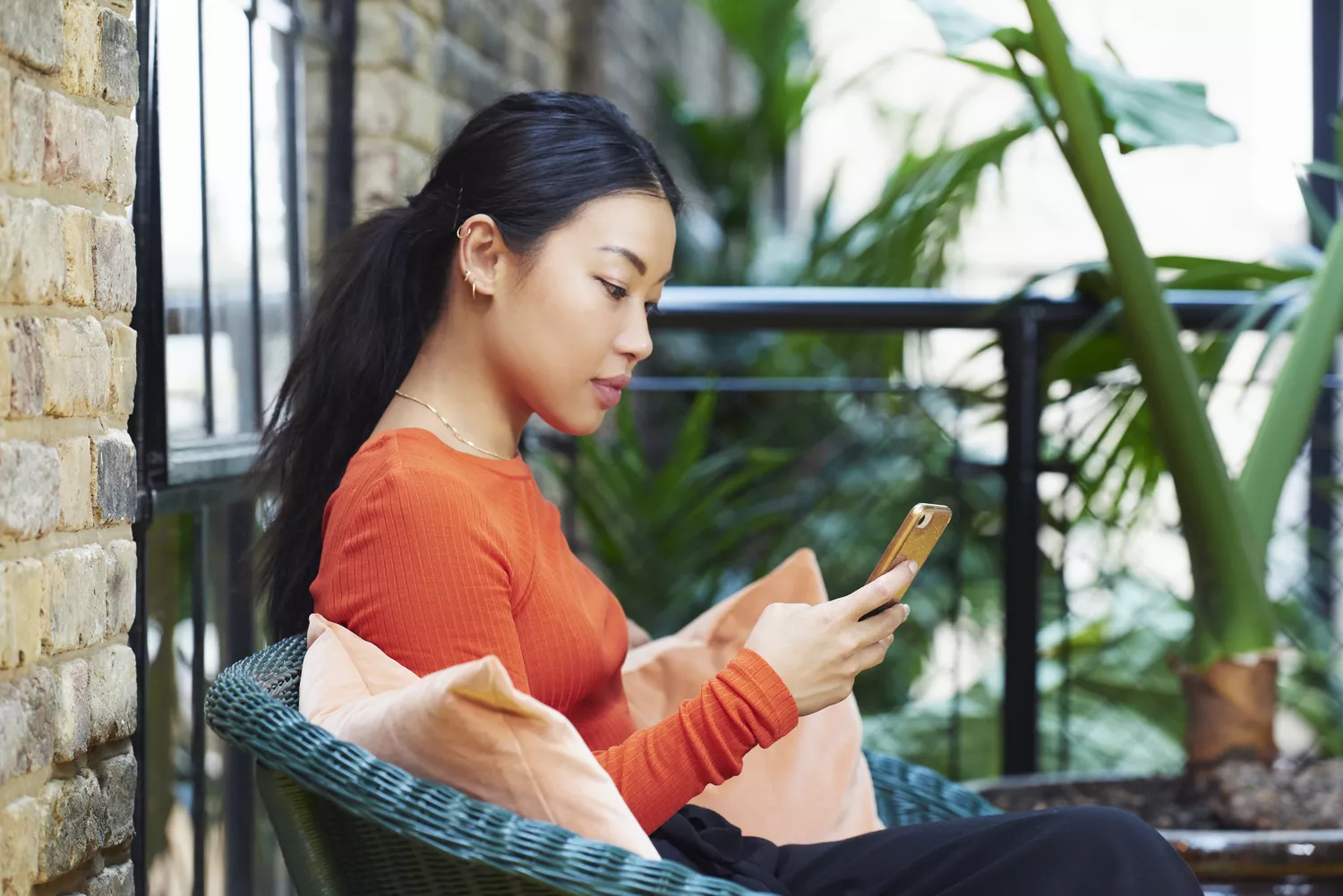 Woman looking at social media on her phone.